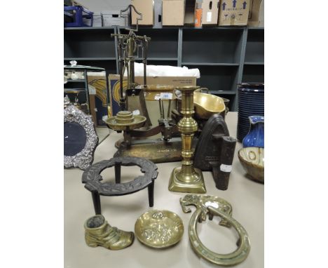 A selection of hardware including copper pot, companion set, scale set and trivet