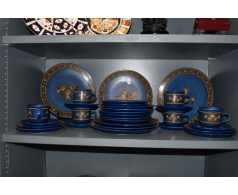 A mid century part dinner and tea service by Winterling Baveria in a blue floral design