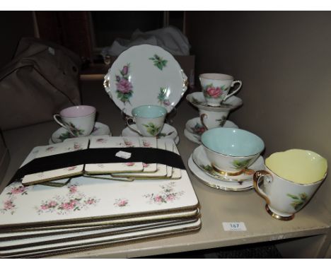 A part tea service by Roslyn china Wheatcroft Roses in a harlequin design with table matts