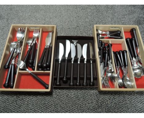 A selection of cutlery and flatware by Denby having ceramic handles in the Regency design