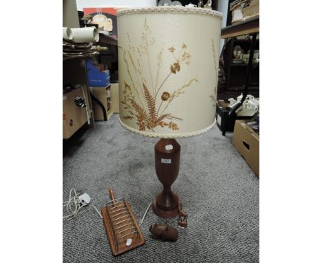 A mid century teak turned wood lamp with collage style shade