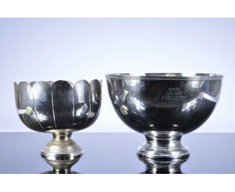 Two large Champagne buckets, the larger aluminium, 40.5cm diameter, marked CUVEE LOUISE POMMERY, the other with scalloped edg