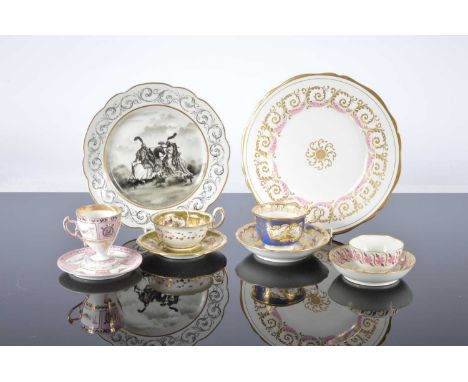 Two porcelain plates and four cups and saucers, one plated with black enamel painted scene of two knights jousting, the other