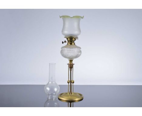 An Arts & Crafts brass and cut glass oil lamp, 50cm plus shade and funnel