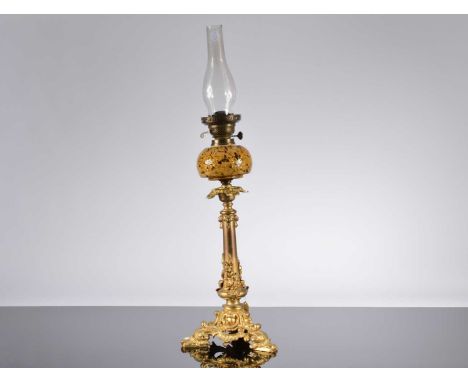 A Victorian oil lamp, 60cm plus funnel, with a spare funnel, lacks shade, the gilt column base with screw off end of day glas