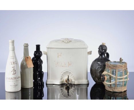 Six wine and spirit related collectables, including a pottery ewer marked J.A. BACZEWSKI, a damaged ceramic cistern with tap,