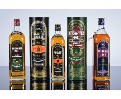 Five bottles of Irish Whiskey by Bushmills, two 1 litre 10 year old single malts in tubes, and a 1 litre Special Old Irish Wh
