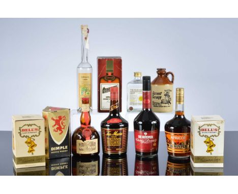 A collection of twelve bottles of spirits and Whiskey, comprising of De Kuyper cherry brandy, Tia Maria, Cointreau and Dimple
