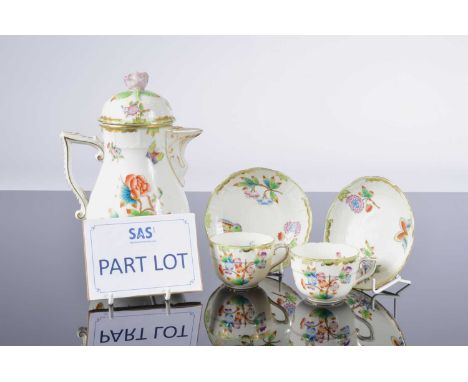 A Herend porcelain coffee set for six, with coffee pot and six small cups and saucers. One cup has a small hairline crack.