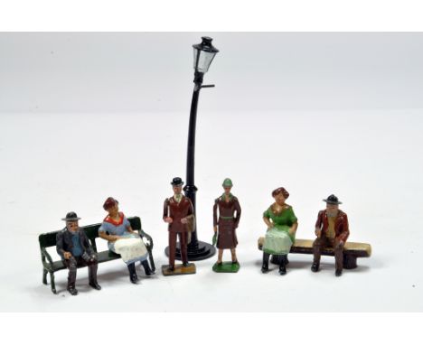 An interesting group of metal figures comprising Man and Lady on bench x 2 plus duo of standing figures. Britains etc plus la