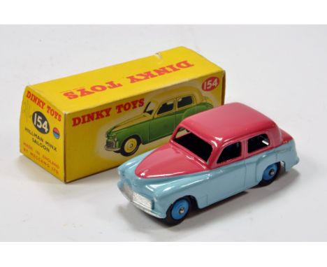 Dinky No. 154 Hillman Minx Saloon in two-tone light blue/pale cerise with blue ridged hubs and black smooth tyres. Lovely bri