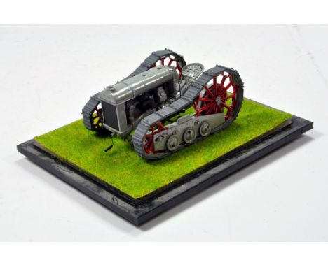 A wondefully assembled from Brass and Metal 1/32 hand built model of a Fordson Trackson Tractor by Tekno Bygg. This Skid Stee