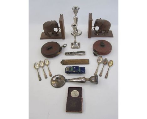 Pair of silver-mounted candlesticks, tapering on circular bases (one damaged), another silver-mounted candlestick, an U.N.C.L
