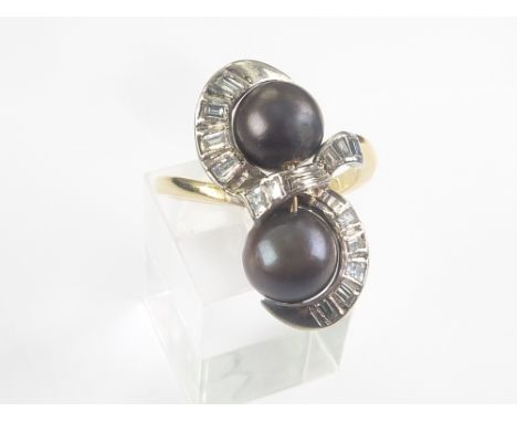 Dress ring with two black pearls each approx. 7mm with baguette diamonds in gold, '18ct'. Size approx. 'K'/'L'.