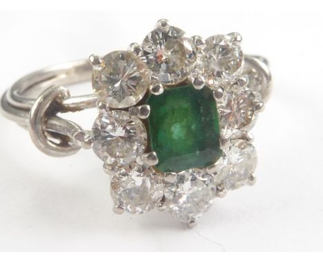 Diamond and emerald oval cluster ring, rectangular with eight brilliants each approx. .2ct in white gold wire mount. Size 'R 