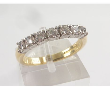 Diamond half eternity ring with seven brilliants in 18ct gold. 'K 1/2'. Condition Report. Weight:  3.3g.