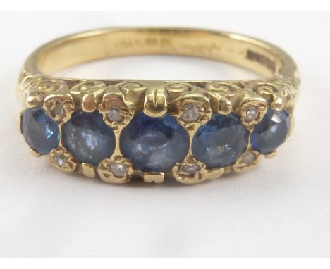 Half hoop ring with five sapphires and small diamonds in 18ct gold. Size O, 5g.