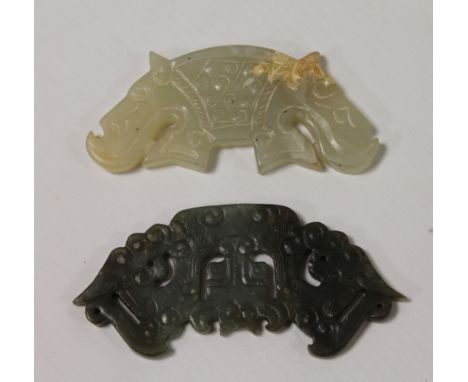 Chinese dark green jade huang, 10cm wide, and a similar celadon jade huang, 9cm wide. (2)