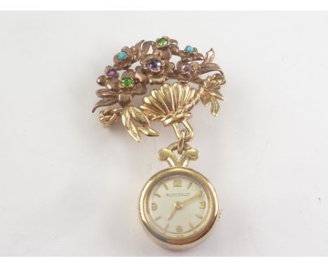 Jaeger LeCoultre watch, back wind, dependant from a brooch of giardinetto style with turquoise, demantoid garnet and other ge