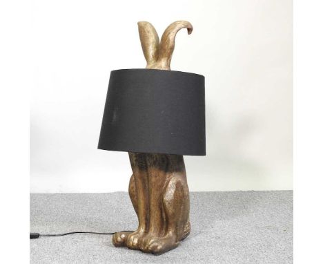 A novelty table lamp and shade, in the form of a gilt hare, by Graham and Green, 76cm high