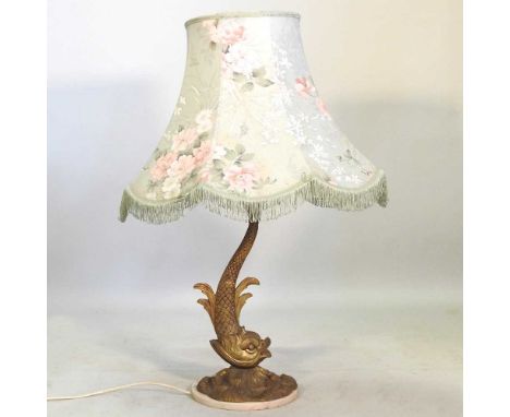 A gilt painted table lamp, in the form of a dolphin, with shade, 86cm high overall