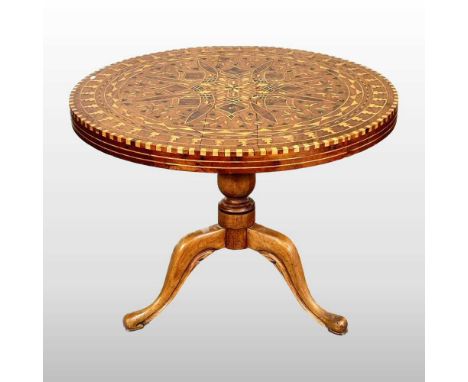 A 19th century yew, fruitwood and parquetry inlaid occasional table, with a hinged circular top, on a tripod base93w x 69h cm