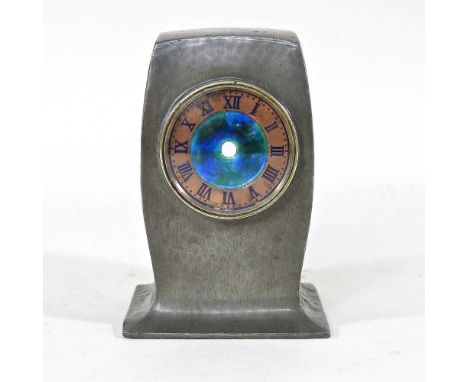 An Arts and Crafts Liberty &amp; Co. Tudric hammered pewter cased mantel clock case, of tapered shape, with enamel dial, stam