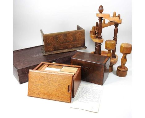 A Takoradi game, comprised of bricks of specimen wood, boxed, 21cm, together with an inlaid tea caddy, a book stand and anoth