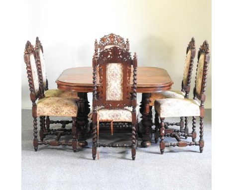 A 19th century extending dining table, together with six 19th century carved oak and dining chairs, with upholstered seats (7