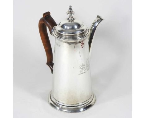 A Queen Anne Britannia standard silver chocolate pot, of tapered shape, with a hinged lid, pearwood handle and spout to one s