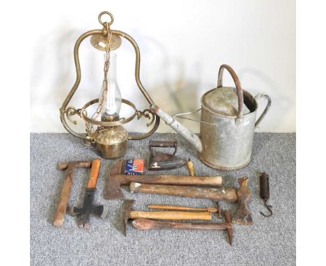 A collection of hand tools, together with a brass light
