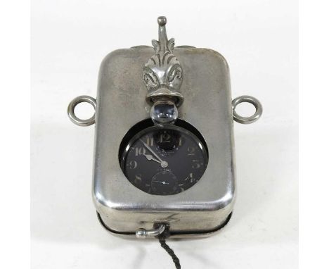 An early 20th century military tin patent pocket watch holder, with a battery operated light switch, 11cm high, containing a 