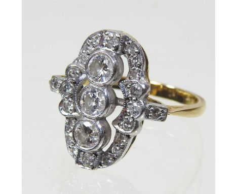An 18 carat gold diamond cluster ring, set with three central diamonds, each approximately 0.2 carats, with a further twenty-