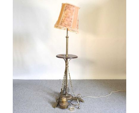 An early 20th century brass telescopic standard lamp, 158cm high, with shade and a spare burner