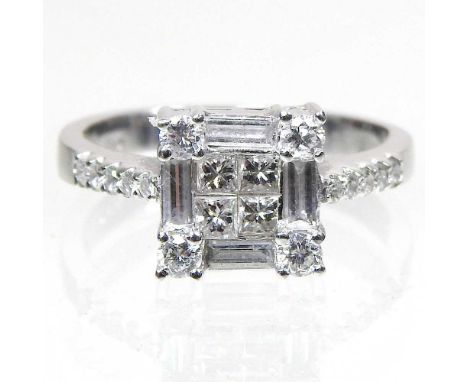 An 18 carat white gold and diamond cluster ring, square set with four central stones, within a diamond surround, with diamond