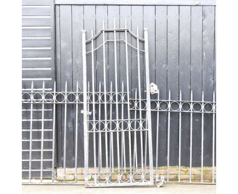A wrought iron garden gate, 93 x 220cm, together with two matching iron railings (3)Overall condition looks to be complete, b