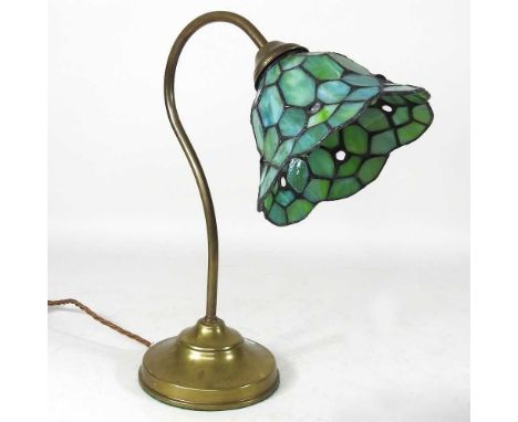 A mid 20th century brass desk lamp, 36cm high, with leaded glass shade