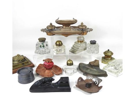 A Victorian brass deskstand, with two inkwells, 34cm wide, together with an Art Nouveau copper desk stand, in the form of a l