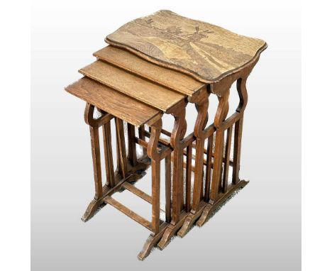 A quartetto of Art Nouveau specimen wood occasional tables, in the manner of Emile Galle, decorated with a marquetry windmill