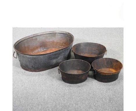A large galvanised planter, with three small oval planters (4)