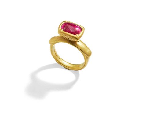 The oval cabochon ruby in a foiled closed back setting, raised above an 18ct gold hoop of saddle design, later UK hallmarkRin