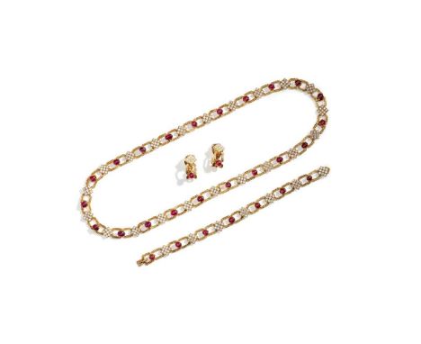 Composed of textured openwork hexagonal links, interspersed with brilliant-cut diamond-set square plaques and cabochon rubies