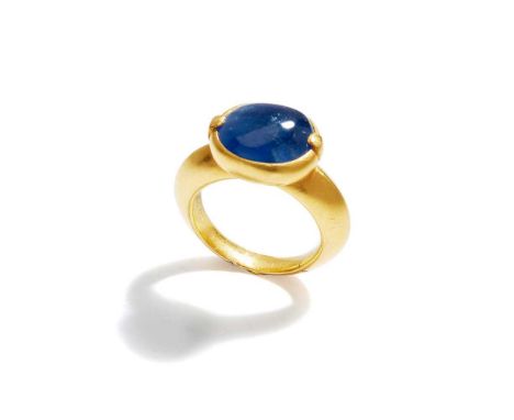 Collet-set with an oval cabochon sapphire to a tapered 18ct gold hoop, UK hallmarkRing size: N