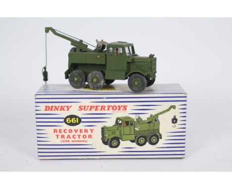 Dinky - A boxed Military Recovery Tractor with windows # 661. The model appears Near Mint with the expected marks from being 
