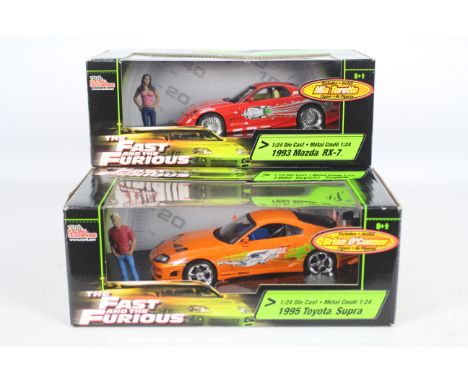 Racing Champions / Ertl - Two boxed 1:24 scale 'Fast &amp; Furious' diecast model cars. Lot includes 1995 Toyota Supra 'Brian