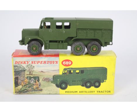 Dinky - A boxed Dinky Medium Artillery Tractor # 689. The model appears Near Mint with only the expected rub marks from being