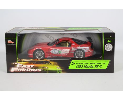 Racing Champions / Ertl - A boxed 1:18 scale 'Fast &amp; Furious' diecast 1993 Mazda RX-7. Model appears Mint in Good overall