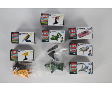 Takara / Tomy - Seven boxed Takara / Tomy Thunderbirds diecast vehicles approx 1:64 scale. The seven models includes TB 1 thr