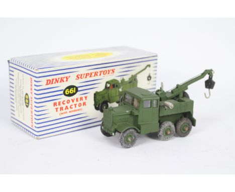 Dinky - A boxed Military Recovery Tractor with windows # 661. The model appears Near Mint with the expected marks from being 