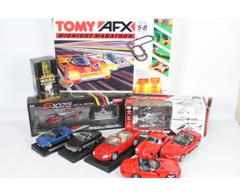 Maisto - Bburago - Tomy - 9 x items including 6 x unboxed cars, 2 x boxed R/C Helicopters and a boxed Tomy AFX Midnight Marat